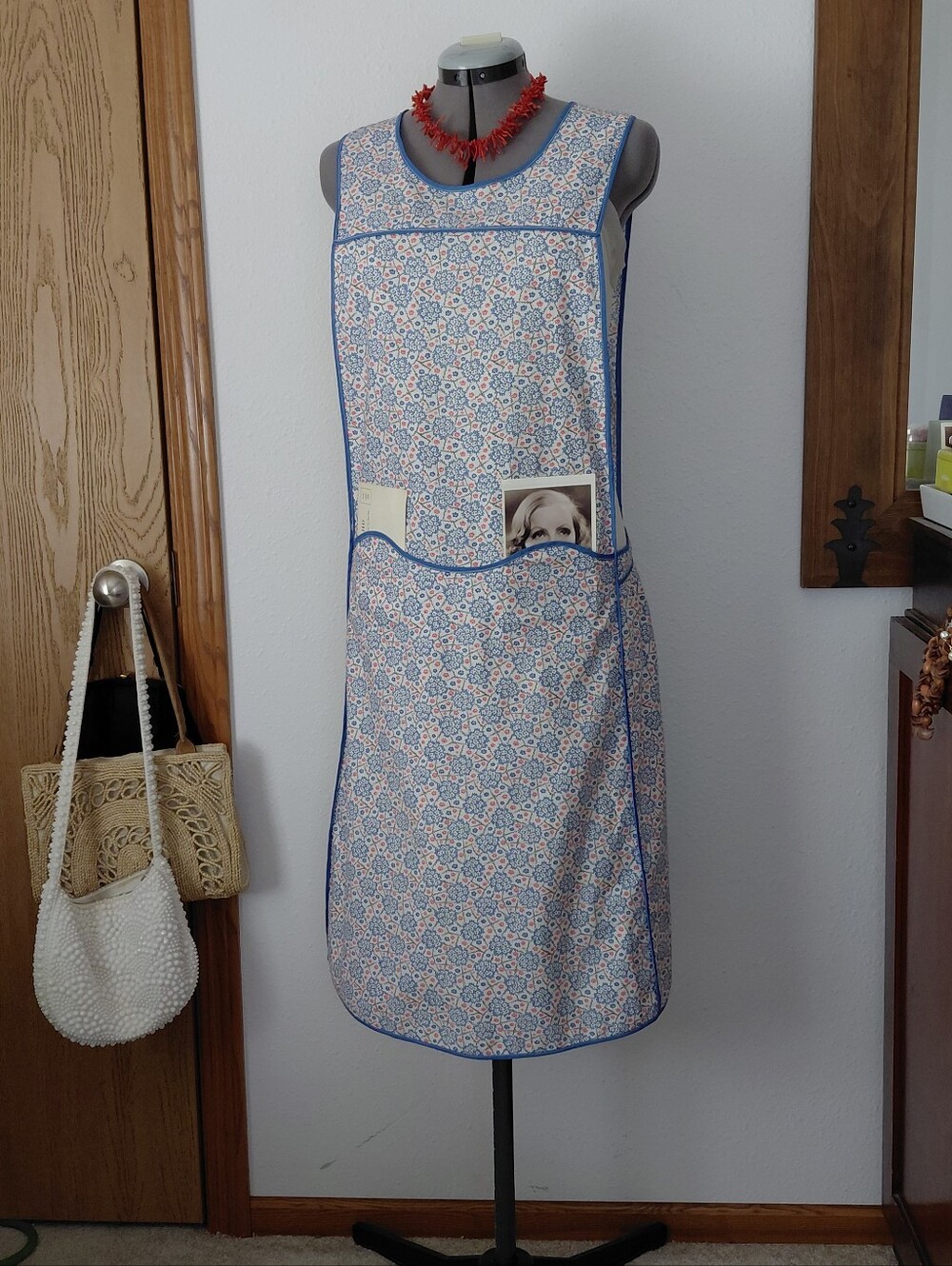 1930s Long Apron with Hidden Pockets in a Blue and Coral Print with Blue Trim